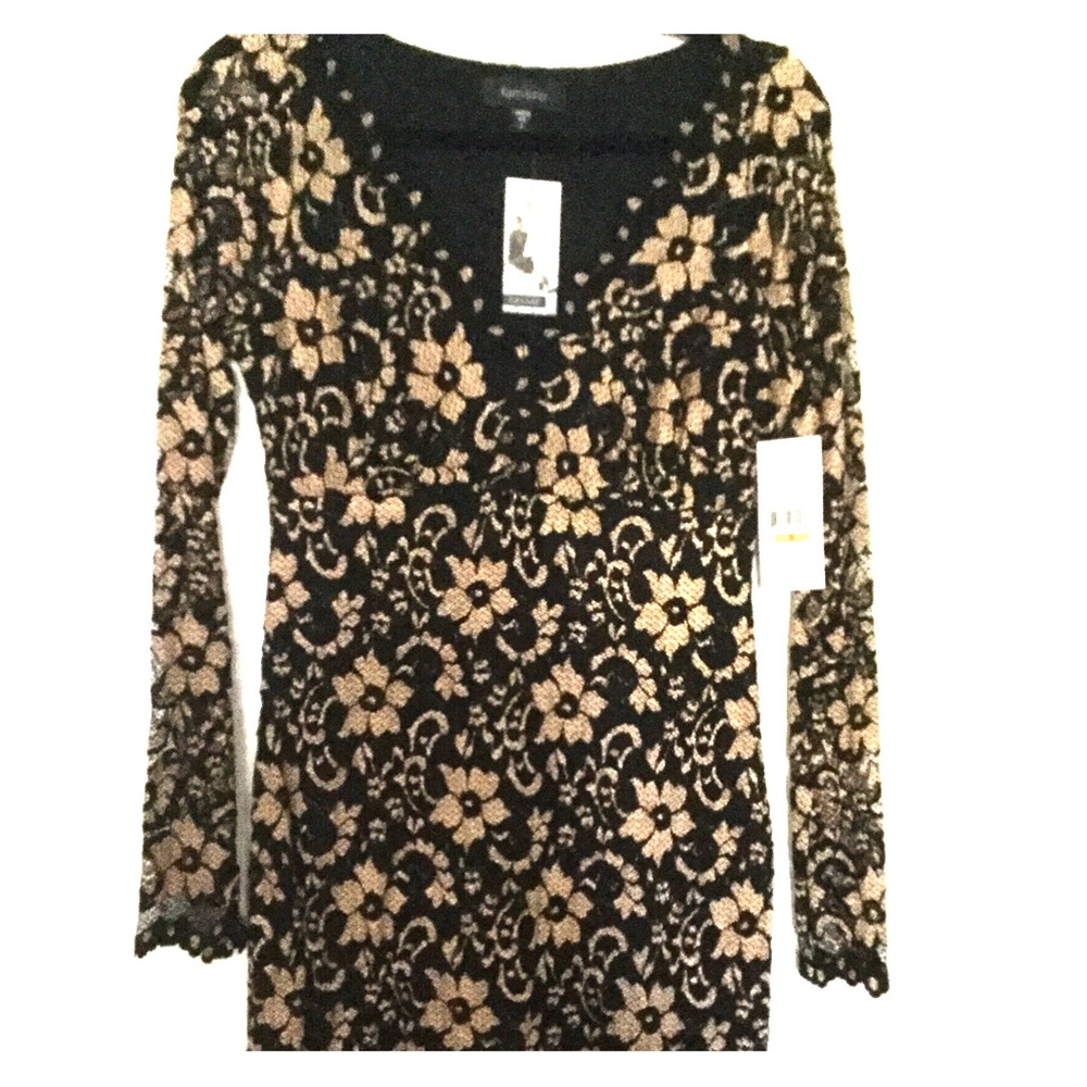Brand new beautiful black overlay on gold lace.